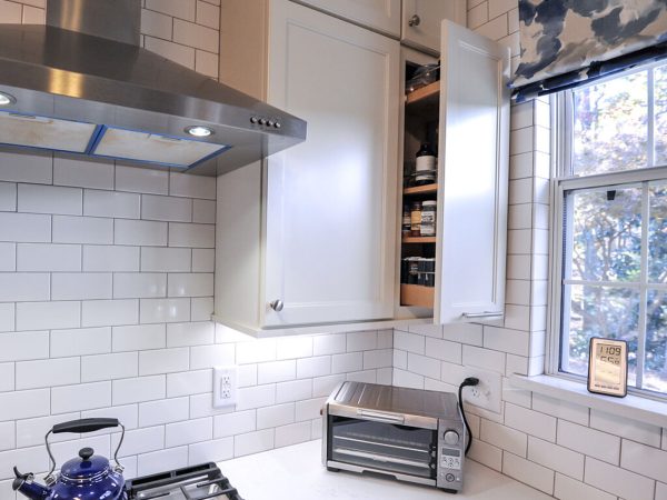 White Countertop & Range Wall with Subway Tile