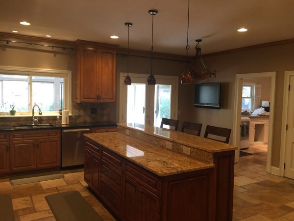 Gold Granite Island in a Warm Wood Kitchen