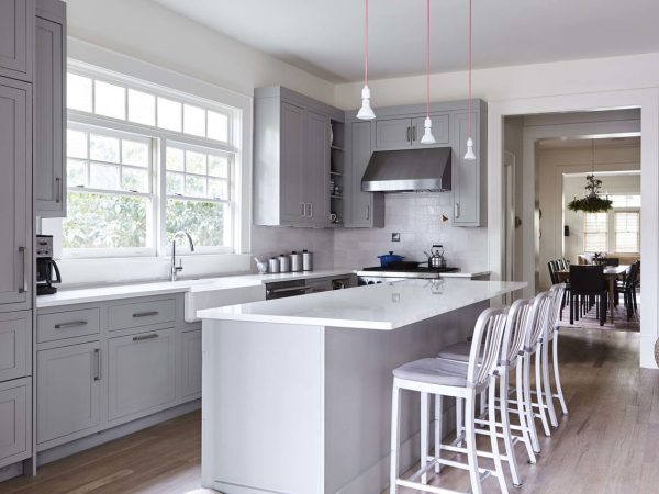 White Quartz Island in a Grey Transitional Kitchen