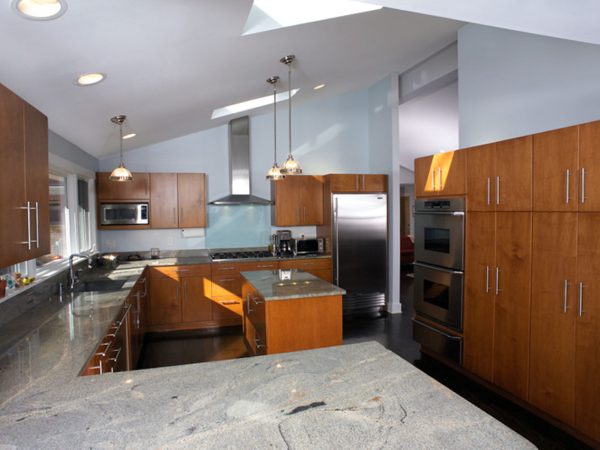 Dramatic Stone Countertops with Wood Cabinetry