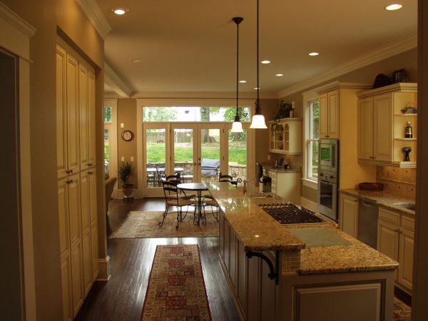 Gold Granite Island Countertop in a Traditional Kitchen