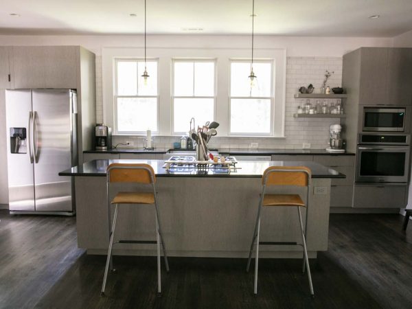 Grey Island with Dark Countertop in a Transitional Kitchen